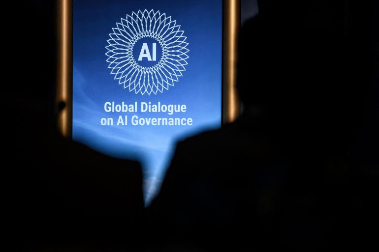 by654-1784714508 This photograph shows the logo of the first Global Dialogue on AI Governance displayed in Geneva on July 6, 2026. UN Secretary-General called for a global governance system to shape artificial intelligence for the good of humanity, warning against allowing the technology itself to "vibe-code" our future. (Photo by Fabrice COFFRINI / AFP)
