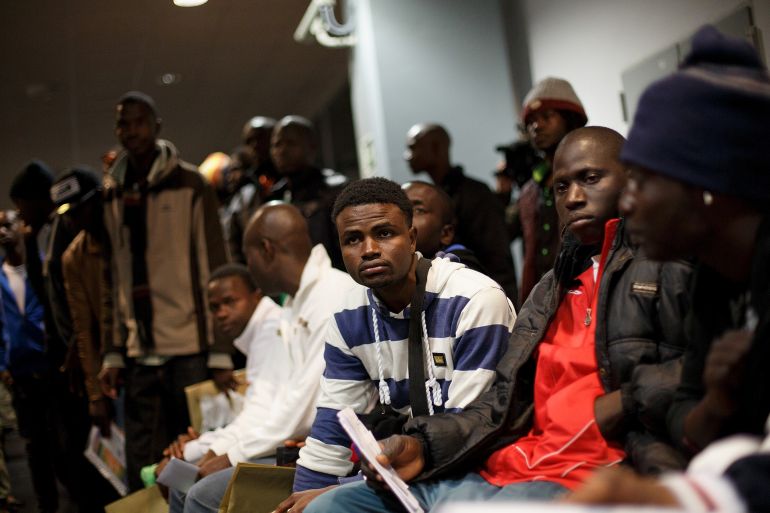 ccc-1-1782829394 MELILLA, SPAIN - MARCH 20: Would-be immigrants wait at the boarding area to receive permits and tickets to travel by ferry to Malaga on March 20, 2014 in Melilla, Spain. Around 500 would-be immigrants entered Melilla on March 17 from Morocco, forcing the Temporary Immigration Centre (CETI) to shelter around four times its capacity, which is 480 people. The army has placed temporary tents outside the Centre to make space while the government has said it plans to send some to the peninsula. (Photo by Pablo Blazquez Dominguez/Getty Images)