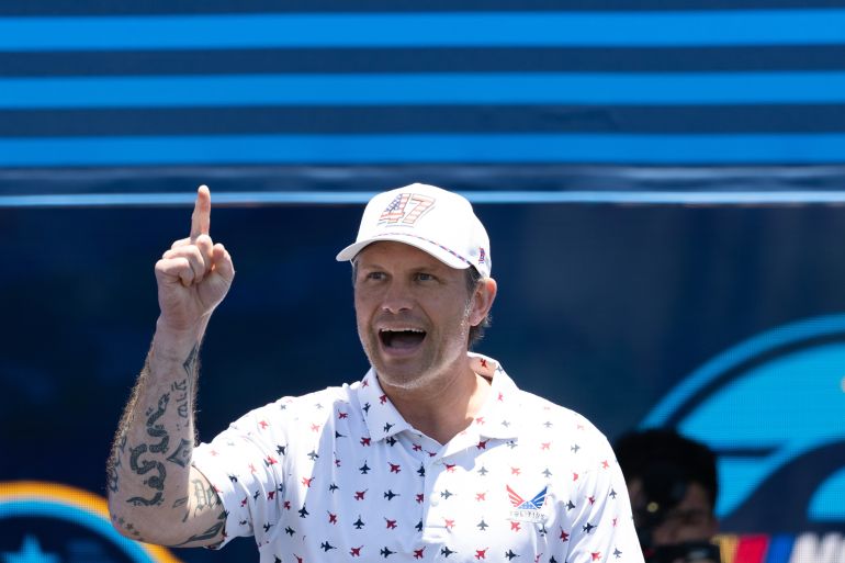 d-1787687112 Jun 21, 2026; San Diego, California, USA; U.S. Secretary of Defense Pete Hegseth walks onstage during pre-race ceremonies prior to the NASCAR Cup Series Anduril 250 at Naval Base Coronado. Mandatory Credit: Karl Anderson-Imagn Images