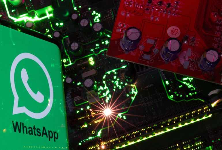 d8b6d8b5d8abd8ab A smartphone with a displayed WhatsApp logo is placed on a computer motherboard in this illustration taken February 23, 2023. REUTERS/Dado Ruvic/Illustration