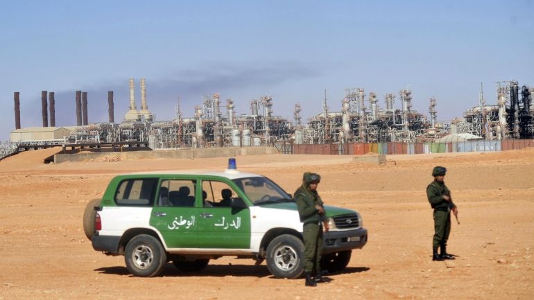 db61f747-0319-4fa0-add8-768f2018c20e FILE - In this Jan. 31, 2013 file photo, Algerian soldiers stand guard during a visit for news media organized by the Algerian authorities at the gas plant in Ain Amenas, seen in background. In Algeria, which has been run by a succession of military men for decades, presidential elections often are foregone conclusion. But not this year. The campaign for the April vote already is raising questions: Will the ailing president run for re-election? If not, will his supporters and the powerful intelligence services be able to agree on someone else? And where does Algeria’s army stand in all this? With the lack of any clear direction from on top, political squabbles are being fought in the media, with the head of the governing party decrying the shadowy intelligence chief’s grip on power, and a journalist accusing the president’s brother of corruption and scandalous personal behavior. (AP Photo, File)