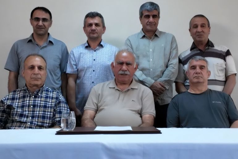 dfghdf-1752211261 This handout photograph released on July 9, 2025 by Mezopotamya News Agency (MA) shows the jailed leader of the Kurdistan Workers' Party (PKK) Abdullah Ocalan (front C) sitting with jailed PKK members Hamili Yildirim (front L), Veysi Aktas (front R), Ergin Atabey (back L), Mahmut Yamalak (back 2nd L), Zeki Bayhan (back 3rd L), Omer Hayri Konar (back 4th L) on Imrali prison island near Istanbul. The Kurdish militant PKK group's disarmament process will happen quickly but establishing a Turkish political framework to ensure the switch to democratic politics will be crucial, its jailed founder said on July 9, 2025. (Photo by HANDOUT / Mezopotamya News agency / AFP) / - TURKEY OUT / RESTRICTED TO EDITORIAL USE - MANDATORY CREDIT "AFP PHOTO / MEZOPOTAMYA NEWS AGENCY" - HANDOUT - NO MARKETING NO ADVERTISING CAMPAIGNS - DISTRIBUTED AS A SERVICE TO CLIENTS - AFP CANNOT INDEPENDENTLY VERIFY THE AUTHENTICITY OR LOCATION, DATE, AND CONTENT OF THESE IMAGES. q