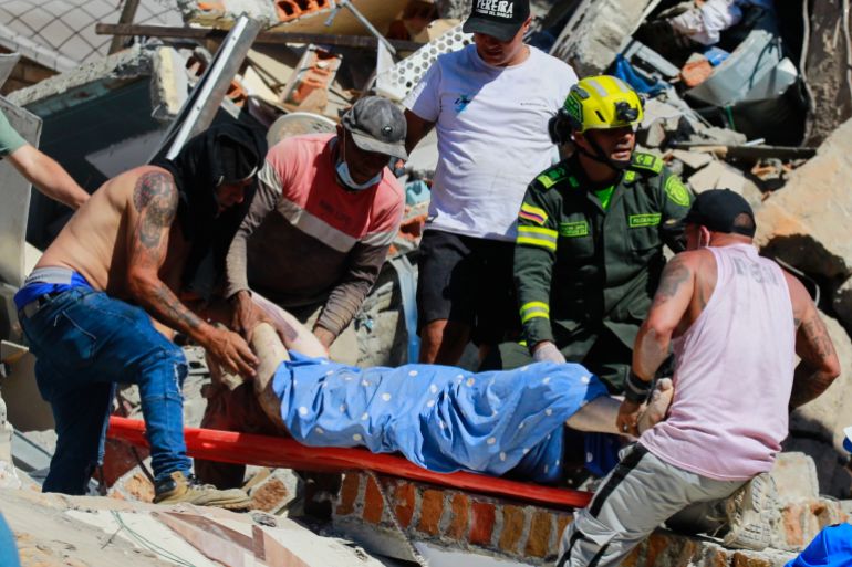 download-1-1786438653 Residents and police carry a survivor pulled from the rubble after an earthquake struck Pereira, Colombia, Monday, Aug. 10, 2026. (AP Photo/Miguel Angel Lopez)