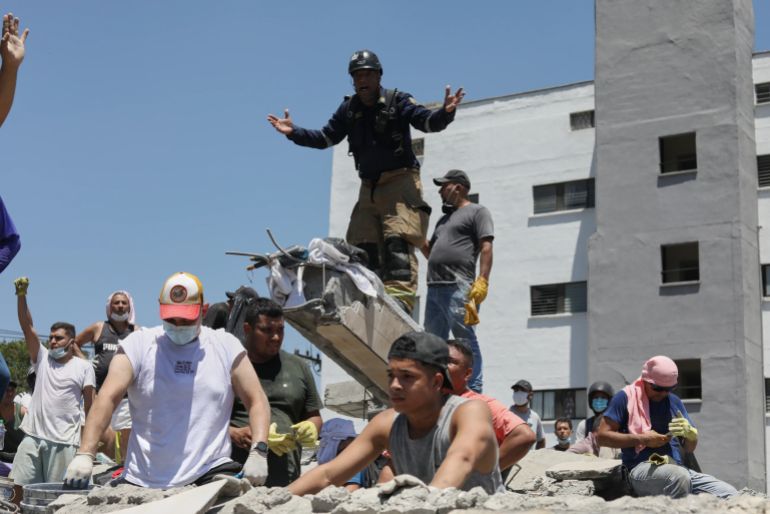 download-11-1786438628 A rescue worker asks for silence during the search for survivors after an earthquake struck Cali, Colombia, Monday, Aug. 10, 2026. (AP Photo/Santiago Saldarriaga)