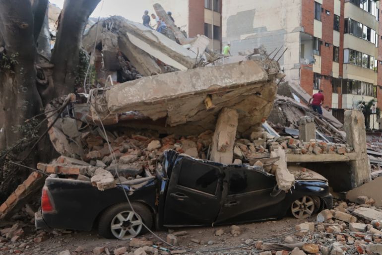 download-5-1786438643 A vehicle is crushed by debris after an earthquake struck Cali, Colombia, Monday, Aug. 10, 2026. (AP Photo/Juan Diaz)