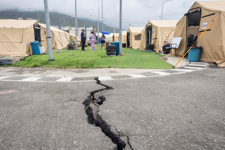 epa_6a60d49f6841-1784730783 epaselect epa13110697 A damaged street near the United Kingdom's field hospital in Caraballeda, Venezuela, 13 July 2026 (issued 14 July 2026). Fourteen international field hospitals have been established in Caracas and the devastated coastal region of La Guaira, near the capital, to provide care for those affected as the search through the rubble continues in the aftermath of the double earthquakes that struck the country on 24 June 2026. EPA/MIGUEL GUTIERREZ