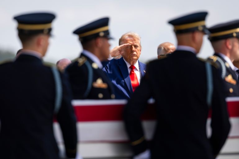 epa_6a6397924e7e-1784911762 epa13126895 US President Donald Trump (C) salutes as a carry team carries the remains of Sergeant Angel Rampersad, who was believed to be killed in an Iranian airstrike in Jordan, during a dignified transfer at Dover Air Force Base in Dover, Delaware, USA, 22 July 2026. Four US service members have been killed since the ceasefire between Iran and the US fell apart. EPA/JIM LO SCALZO