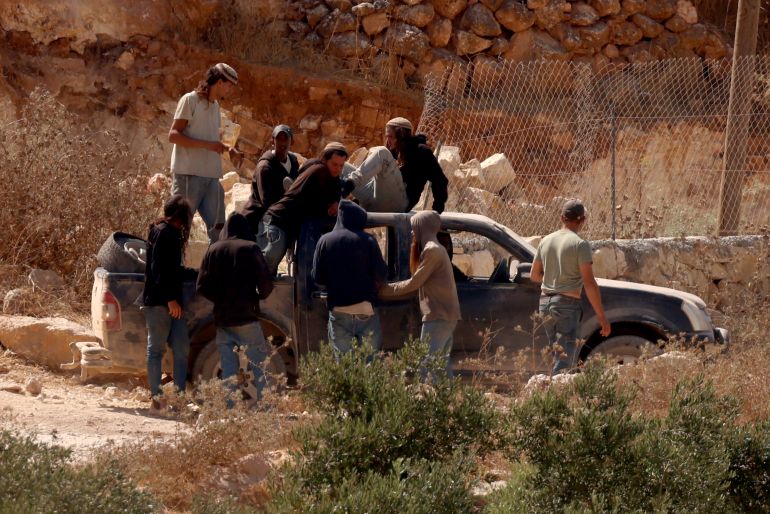 epa13163909 Israeli settlers besiege a Palestinian home for the fourth consecutive day in the town of Qusra, south of Nablus, 12 August 2026. According to the Wafa news agency, Israeli settlers raided the vicinity of three Palestinian houses in the Ras al-Ain area of Qusra, imposed a siege around them, prevented residents from reaching the properties and erected a tent nearby under the protection of Israeli forces. EPA/ALAA BADARNEH