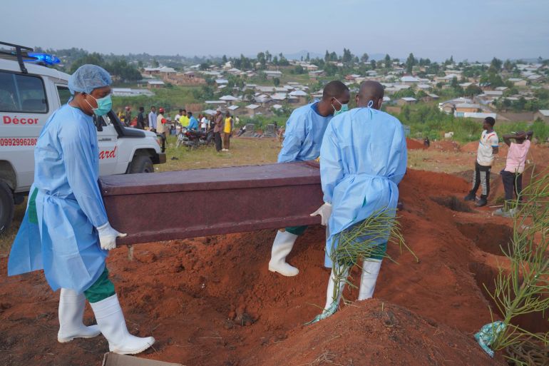epa_6a887ed4b3d2-1787330260 epa13177740 Members of the response team transport the body of Baudo Baraka Jules to the cemetery for burial in Bunia, Democratic Republic of the Congo, 18 August 2026. Jules died at the Ebola Treatment Center (ETC) northeast of Bunia after reportedly developing fever and vomiting, symptoms also experienced by his mother, while his father remains under observation at the same facility. EPA/DIEUDONNE DIROLE
