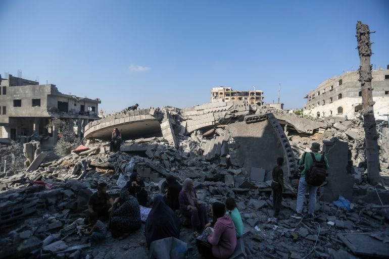 getty_6a6e86ecf1-1785628397 GAZA CITY, GAZA - AUGUST 1: Residents sit among the damage caused by Israeli airstrikes last night on residential buildings in the Safatawi area on August 1, 2026 in Gaza City, Gaza. Israel continues military actions in Gaza during the fragile easefire agreement which is frequently contested, and marred by mutual accusations of violations. (Photo by Ahmad Hasaballah/Getty Images)
