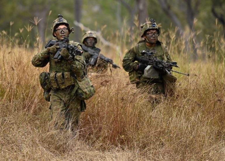 TOWNSVILLE, AUSTRALIA - JUNE 17: Soldiers from the Japanese Ground Self Defence Force (JGSDF) conduct a clearance operation of an enemy position in the fictional town of 'Line Creek Junction' on June 17, 2026 in Townsville, Australia. Personnel from Australia, the United States, Japan and the Republic of Korea gather at the Townsville Field Training Area to conduct the largest Australian Army exercise of 2026, which will see more than 3,000 troops train together through 2 July. (Photo by Ian Hitchcock/Getty Images)
