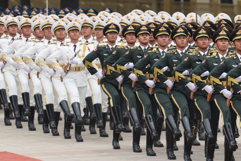 BEIJING, CHINA - MAY 20: Chinese People's Liberation Army (PLA) honour guards march during a welcome ceremony for Russian President Vladimir Putin at the Great Hall of the People on May 20, 2026 in Beijing, China. The two leaders are expected to reaffirm strategic ties between Russia and China amid ongoing Western pressure over the war in Ukraine. (Photo by Maxim Shemetov - China Pool/Getty Images)