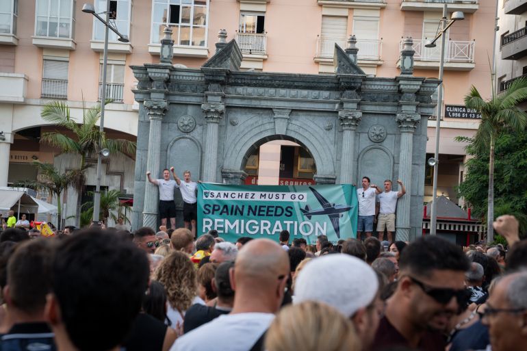 CEUTA, SPAIN - AUGUST 2: Supporters of the remigration movement attend a protest organized by several far-right groups on August 2, 2026 in Ceuta, Spain. Spain's interior ministry has said it's deploying 60 members of the armed forces and an additional 30 Guardia Civil officers to Ceuta after tens of thousands of migrants entered the Spanish enclave in North Africa on Thursday. A large number of people swam through the Tarajal breakwater to enter the Spanish territory from neighboring Morocco, while others scaled the border fence. Some estimates have said that around 60,000 migrants made the crossing this week, with the surge of arrivals overwhelming migrant reception centres, leaving many sleeping on the streets overnight. At least 80 people reportedly died attempting to make the crossing. Spain says the majority of migrants have now been returned to Morocco. (Photo by Adri Salido/Getty Images)