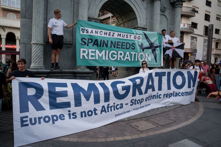 getty_6a7a04a254-1786381474 CEUTA, SPAIN - AUGUST 2: Supporters of the remigration movement attend a protest organized by several far-right groups on August 2, 2026 in Ceuta, Spain. Spain's interior ministry has said it's deploying 60 members of the armed forces and an additional 30 Guardia Civil officers to Ceuta after tens of thousands of migrants entered the Spanish enclave in North Africa on Thursday. A large number of people swam through the Tarajal breakwater to enter the Spanish territory from neighboring Morocco, while others scaled the border fence. Some estimates have said that around 60,000 migrants made the crossing this week, with the surge of arrivals overwhelming migrant reception centres, leaving many sleeping on the streets overnight. At least 80 people reportedly died attempting to make the crossing. Spain says the majority of migrants have now been returned to Morocco. (Photo by Adri Salido/Getty Images)