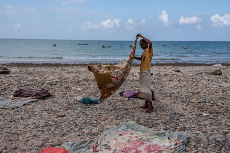 getty_6a91b75032-1787934544 SOCOTRA ISLAND, YEMEN - OCTOBER 12: A young man shakes a blanket used by fisherman on October 12, 2025 in Socotra, Yemen. Socotra, the largest island in an eponymous archipelago, lies 150 miles off the Horn of Africa, and even farther from mainland Yemen. Its relative isolation has mitigated the impact of Yemen's long-running and stalemated civil war, rendering it safe enough to attract a small but steady stream of foreign tourists. However, it has not been untouched by regional hostilities. In recent years, the UAE-backed secessionist group Southern Transitional Council wrested control of the island from the Saudi-backed internationally recognized government. The STC ultimately joined the government's Presidential Leadership Council, but the UAE retains considerable military and economic influence in the archipelago. (Photo by Carl Court/Getty Images)