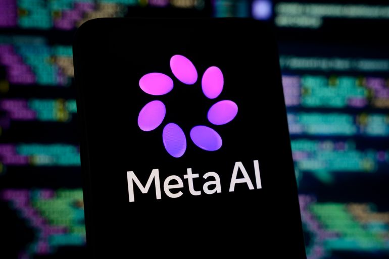 gettyimages-2269982950-1786279400-3 The new Meta AI logo is displayed on a smartphone screen with lines of computer code in the background, in Creteil, France, on April 9, 2026. Meta unveils Muse Spark, its most powerful new AI model, along with a new visual identity for Meta AI. (Photo by Samuel Boivin/NurPhoto via Getty Images)