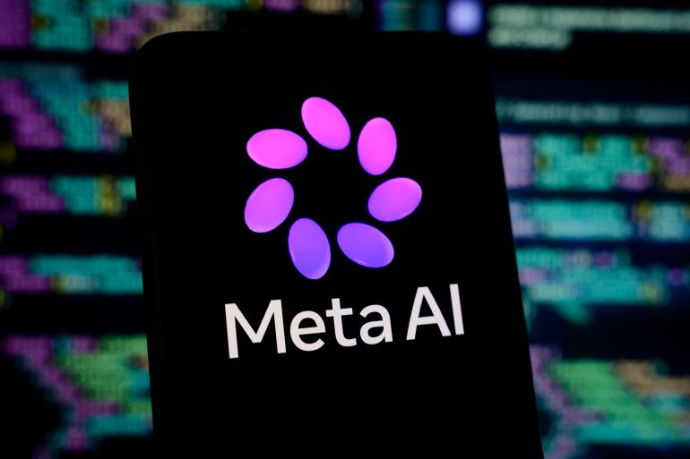 gettyimages-2269982950-1786279400 The new Meta AI logo is displayed on a smartphone screen with lines of computer code in the background, in Creteil, France, on April 9, 2026. Meta unveils Muse Spark, its most powerful new AI model, along with a new visual identity for Meta AI. (Photo by Samuel Boivin/NurPhoto via Getty Images)