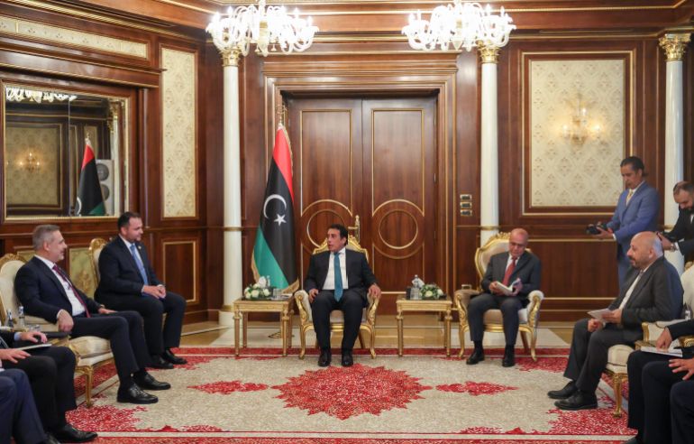 gettyimages-2289551481-1786475016 TRIPOLI, LIBYA - AUGUST 11: (----EDITORIAL USE ONLY - MANDATORY CREDIT - 'TURKISH FOREIGN MINISTRY / HANDOUT' - NO MARKETING NO ADVERTISING CAMPAIGNS - DISTRIBUTED AS A SERVICE TO CLIENTS----) Turkish Foreign Minister Hakan Fidan meets Libyan Presidential Council Chairman Mohamed al-Menfi in Tripoli, Libya on August 11, 2026. (Photo by Turkish Ministry of Foreign Affairs / Handout/Anadolu via Getty Images)