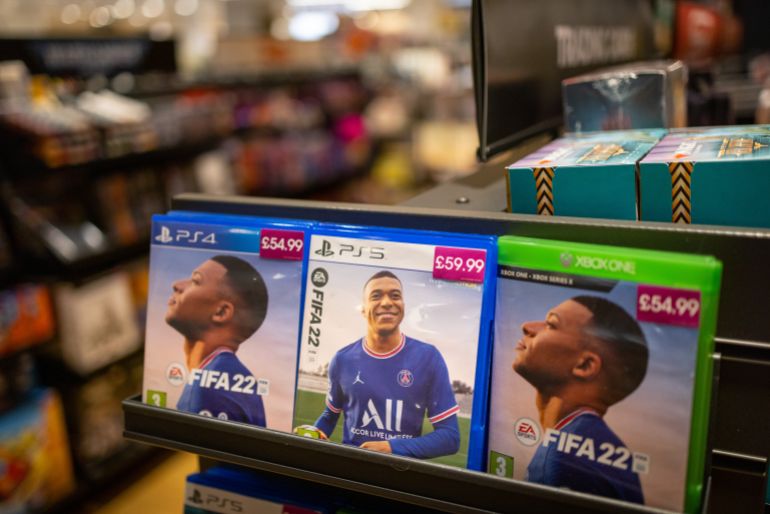 h_57670523 epa09939740 French soccer player Kylian Mbappe on the cover of displayed copies of FIFA 22 at a GAME store in London, Britain, 11 May 2022. Electronic Arts has announced that it will cease making Fifa-branded football games from 2023, the series will continue under a new brand, EA Sports FC. EPA-EFE/TOLGA AKMEN