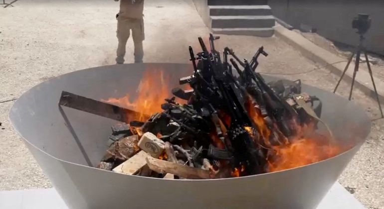 reuters_68716934-1752262964 Weapons placed by PKK fighters are burnt during a disarming ceremony in Sulaimaniya, Iraq, July 11, 2025, in this screengrab obtained from a handout video. KURDISTAN WORKERS PARTY MEDIA OFFICE/Handout via REUTERS THIS IMAGE HAS BEEN SUPPLIED BY A THIRD PARTY