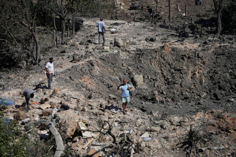 reuters_6a748e6b-1786023531-1 People and journalists stand at a site hit by Israeli strikes that occurred in the early hours of Thursday, according to Lebanon’s state news agency NNA, in Burj al-Shamali, southern Lebanon, August 6, 2026. REUTERS/Stringer TPX IMAGES OF THE DAY