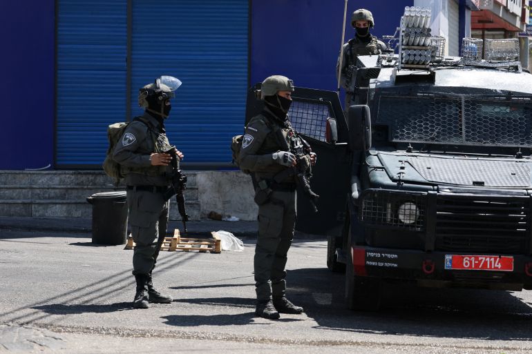 reuters_6a778f04-1786220292 Israeli forces take part in a raid in Qalandia refugee camp, in the Israeli-occupied West Bank, August 6, 2026. REUTERS/Ammar Awad
