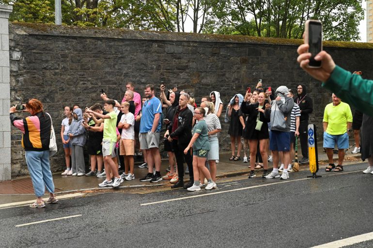 People gather outside the Special Criminal Court where alleged Irish crime gang boss Daniel Kinahan is due to appear on charges of organised criminal activity after being extradited to Ireland from the United Arab Emirates (UAE), in Dublin, Ireland, August 9, 2026. REUTERS/Natalia Campos