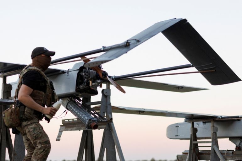 reuters_6a7a2b42-1786391362 A service member of the 414th Separate Unmanned Strike Aviation System Brigade 'Magyar's Birds' of the Ukrainian Armed Forces checks an FP-1 deep-strike drone before it launches for a combat mission, amid Russia's attack on Ukraine, in an undisclosed location in Ukraine, in 2026. REUTERS/Valentyn Ogirenko
