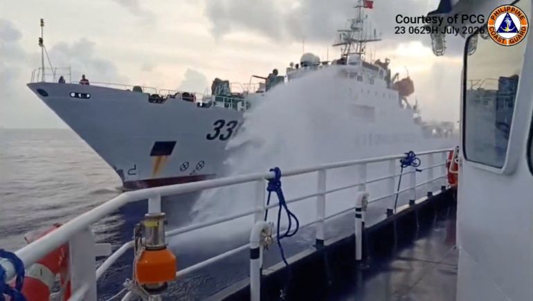 reuters_6a7b7430-1786475568 A Chinese coast guard ship fires a water cannon at a Philippine vessel, in this screengrab taken from a handout video released on July 23, 2026, location given as South China Sea. Jay Tarriela via X/Handout via REUTERS THIS IMAGE HAS BEEN SUPPLIED BY A THIRD PARTY MANDATORY CREDIT VERIFICATION: -Reuters was not able to independently verify the date and location when the video was filmed -Philippines Coast Guard on Thursday (July 23) said a Chinese coast guard vessel fired water cannon at a Philippine fisheries vessel on July 23. -Exterior and structure of the Chinese flagged on vessel matched file images of China Coast Guard ships -No older version of the footage was found posted online before July 23