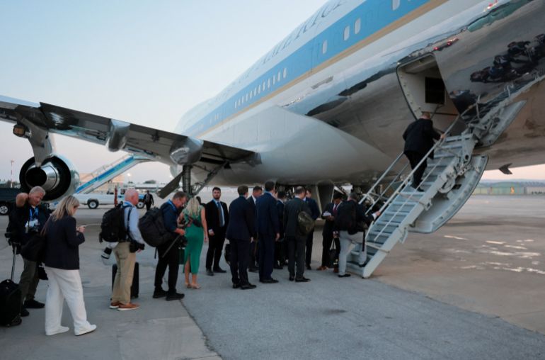 reuters_6a7d83b5-1786610613 FILE PHOTO: People board Air Force One carrying U.S. President Donald Trump, en route to Washington after his participation in the NATO leaders' summit, at Ankara Esenboga Airport in Ankara, Turkey, July 8, 2026. REUTERS/Jonathan Ernst/File Photo