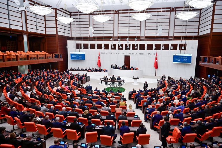 reuters_6a7d84c5-1786610885 Turkish lawmakers attend a voting session on a bill establishing a legal framework for the disbandment of the Kurdistan Workers Party (PKK) at the Turkish parliament in Ankara, Turkey, August 10, 2026. Parliament later passed the bill, a major step towards ending a conflict that has killed tens of thousands. REUTERS/Stringer TURKEY OUT. NO COMMERCIAL OR EDITORIAL SALES IN TURKEY.