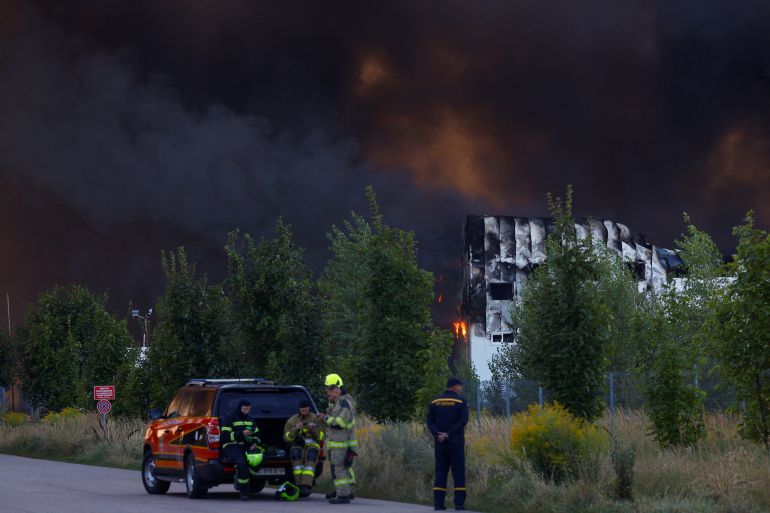 reuters_6a86a3bf-1787208639 Firefighters at the side of a food warehouse hit by a Russian missile strike, amid Russia's attack on Ukraine, in Kyiv region, Ukraine August 20, 2026. REUTERS/Valentyn Ogirenko