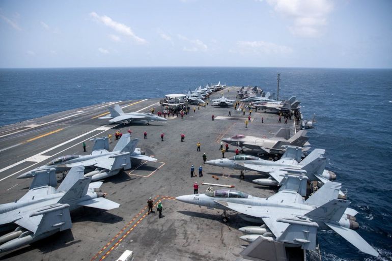 reuters_6a90902f-1787858991-1 U.S. Navy sailors work on the flight deck of the aircraft carrier USS George Washington as it transits the Arabian Sea to support U.S. military operations in the war with Iran August 20, 2026. U.S. Navy/Handout via REUTERS THIS IMAGE HAS BEEN SUPPLIED BY A THIRD PARTY