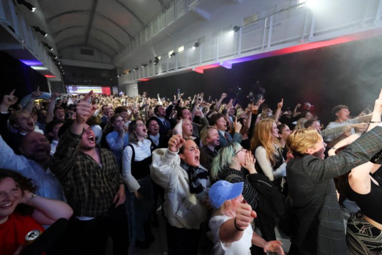 Supporters of the "Yes to See" campaign, which supports resuming EU accession negotiations, react to the early projections of a referendum on whether Iceland should resume accession negotiations with the European Union, in Reykjavik, Iceland, August 30, 2026. REUTERS/Leonhard Foeger