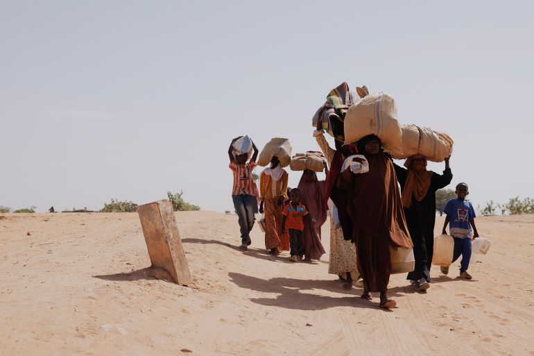 ADRE, CHAD - APRIL 22: Newly arrived refugees fleeing fighting in Darfur arrive at the border between Sudan and Chad on April 22, 2024 in Adre, Chad. Since the beginning of the recent conflict between the paramilitary Rapid Support Forces (RSF) and the the Sudanese Armed Forces, (SAF), which began in March 2023, over 600,000 new refugees have crossed the border from Darfur in Sudan, into Chad. The total number of refugees, including those from previous conflicts, now stands at 1.2 million. Aid agencies, including The World Food Programme, (WFP), Médecins Sans Frontières (MSF) and the United Nations High Commissioner for Refugees, (UNHCR), already struggling with accute supply shortages, have warned that the life-saving programmes in Chad, will ‘grind to a halt in a matter of weeks without urgent funding’. Chad is now home to one of the largest and fastest-growing refugee populations in Africa. (Photo by Dan Kitwood/Getty Images)
