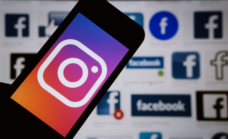 Moscow, Russia - March, 24 2019 The logos of social media networks Facebook and Instagram are displayed on a smartphone
