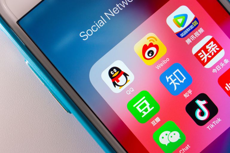 shutterstock_1880287342-1762081583 Kumamoto, JAPAN - Oct 3 2020 : The Chinese Popular Social Media Services Icons (Tencent QQ, Sina Weibo, Tencent Video, Douban, Zhihu, Jinri Toutiao WeChat, TikTok, Xiao Hong Shu) on iPhone Screen.