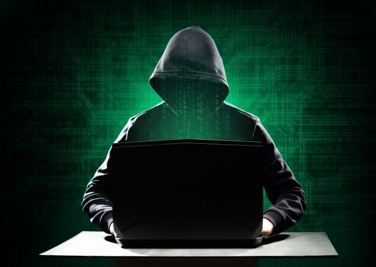shutterstock_2141075675-1761215087 Computer Hacker in Hoodie. Obscured Dark Face. Hacker Attack, Virus Infected Software, Dark Web and ...