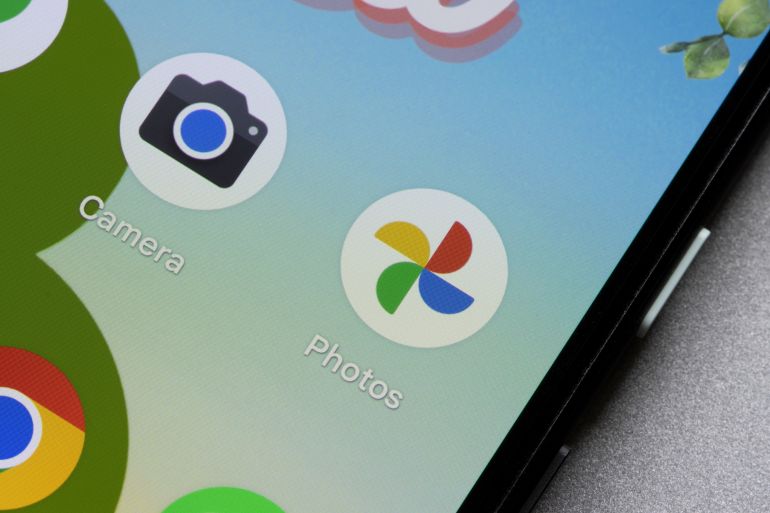 Portland, OR, USA - Jun 4, 2022: Google Photos and Camera app icons are seen on a Google Pixel 4a smartphone.
