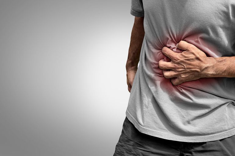 shutterstock_2208188065-1776350399 Stomachache Pain or painful stomach ache as an abdominal illness as Crohn's disease or IBS and Ulcers representing intestinal inflammation or bloating.