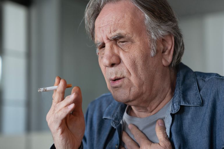 shutterstock_2246803349-1760464393 Old man smoking a cigarette; Shutterstock ID 2246803349; purchase_order: aj; job: ; client: ; other: