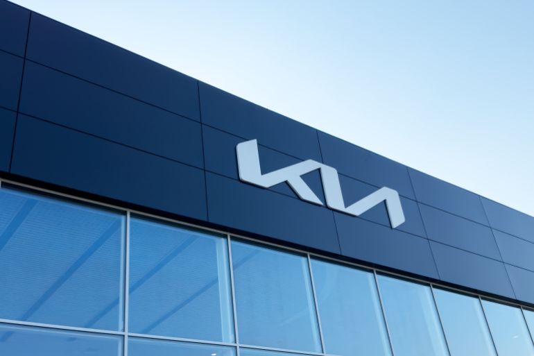 Yerevan, Armenia, August 6, 2023: Kia dealership store. Kia Motors logo on building facadeر