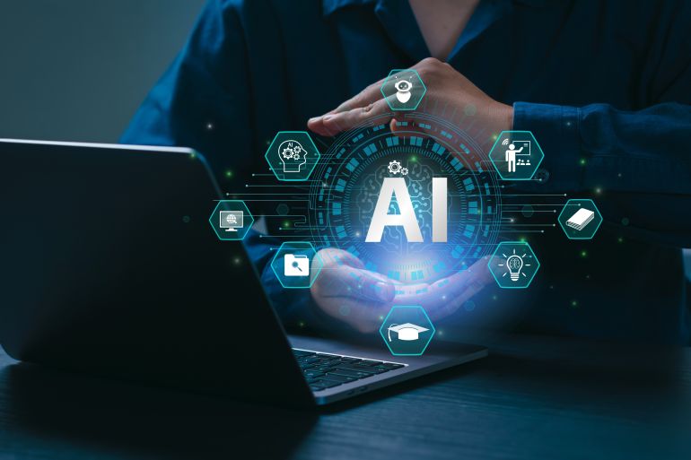 shutterstock_2569109681-1780228543 AI Artificial Intelligence and Education technology concept. A man use laptops, Learn lessons and online webinars successfully in modern digital learning, Courses to develop new skills. E-learning.