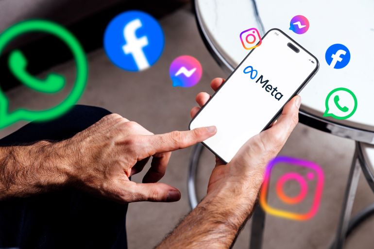Meta on mobile phone screen. Man holding smartphone showing Meta logotype and other brands like Facebook and Instagram. Ads concept. Rosario, Argentina - January 20, 2025.