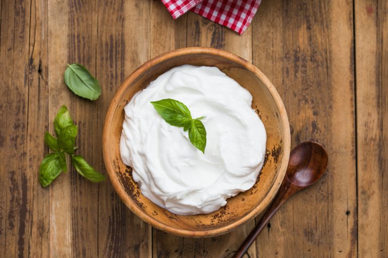 shutterstock_2665139607-1775649626 Thick and creamy Greek yogurt served in a rustic wooden bowl. Healthy dairy product, perfect for breakfast, snacks, or clean eating lifestyle