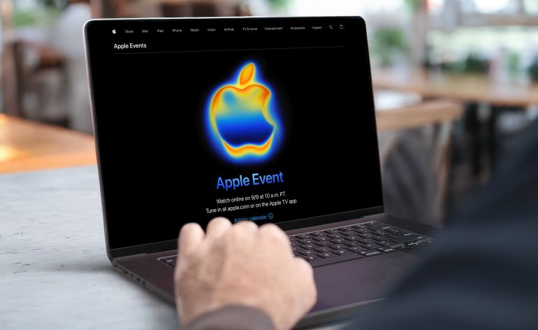 shutterstock_2673799859-1780840875 Businessman using a MacBook Pro laptop with the upcoming Apple Event 2025 announcement on screen. Concept of online streaming, global product launch, and digital innovation. Qatar, September 03, 2025