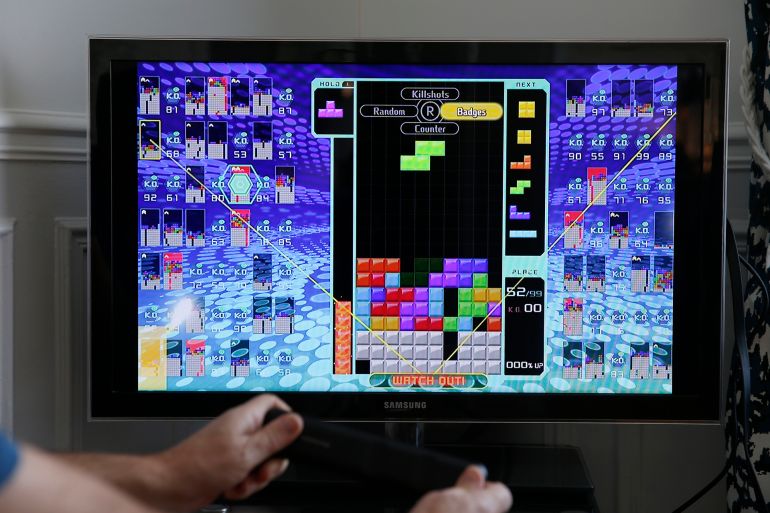 5870436-3-1788686040 PARIS, FRANCE - FEBRUARY 18: In this photo illustration a gamer plays the game Tetris 99 developed by Arika and published by Nintendo on February 18, 2019 in Paris, France. Last Wednesday the Japanese company Nintendo unveiled its new game Tetris 99, a Battle Royale version of the legendary Tetris. (Photo by Chesnot/Getty Images)