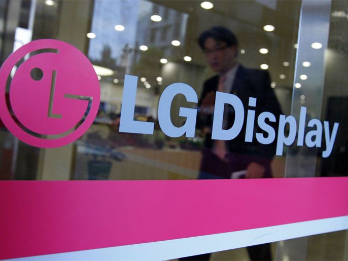 65d0abd1-fbbb-45ec-9f3d-ce4061249a9e A man walks out of the headquarters of LG Display in Seoul, October 20, 2011. South Korean flat-screen maker LG Display, a key supplier to Apple Inc, posted a wider-than-expected quarterly loss on Thursday as tepid demand for TVs and PCs hit panel prices and one-off losses weighed.