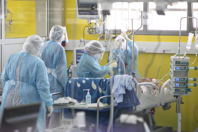 768768-1786112098 TUNIS, TUNISIA - FEBRUARY 05: Doctors are seen as they check patients infected with the novel type of coronavirus (COVID-19), at the field hospital in Menzah district of Tunis, Tunisia on February 05, 2021. The sport comlpex was converted into a field hospital for use in the treatment of increasing COVID-19 cases. In Tunisia, 62 people died while 1,064 people contracted COVID-19, pushing the toll to 7,162 and 216,176 respectively. Total recoveries reached 172,885 with 1,742 additions. (Photo by Yassine Gaidi/Anadolu Agency via Getty Images)