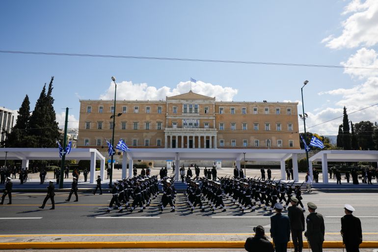 8465-1788207618 Hellenic Navy officers march during a military parade marking the 200th anniversary of the Greek War of Independence, in Athens, Greece March 25, 2021. REUTERS/Alkis Konstantinidis
